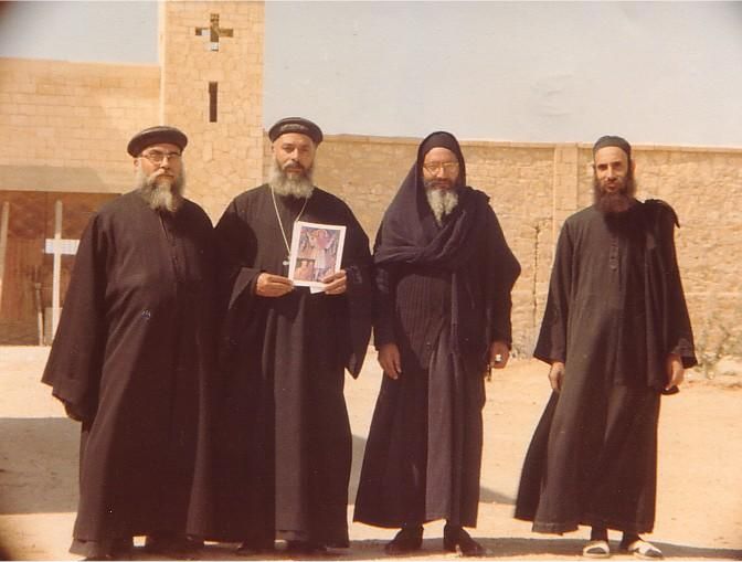 Photo of Father (Abouna) Philemon Nematalla (left), Father (Abouna) Mina Nematalla, the late Bishop Mina Ava-Mina, and Father (Abouna) Raphael AvaMina (right)